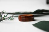 cross_grain_santos_rosewood_with_cherry_lining_wooden_ring_and_rose_gold_inlay_lying_down_1_of_1_compact Img