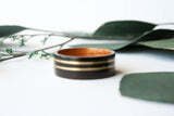 wide_ebony_wooden_ring_with_koa_wood_lining_and_double_wide_yellow_gold_inlay_compact Img